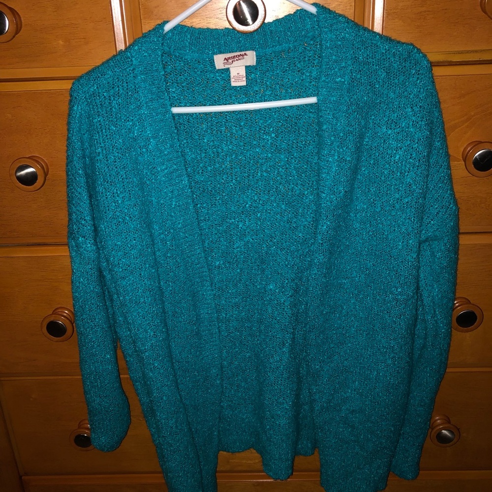 A turquoise sweater cardigan